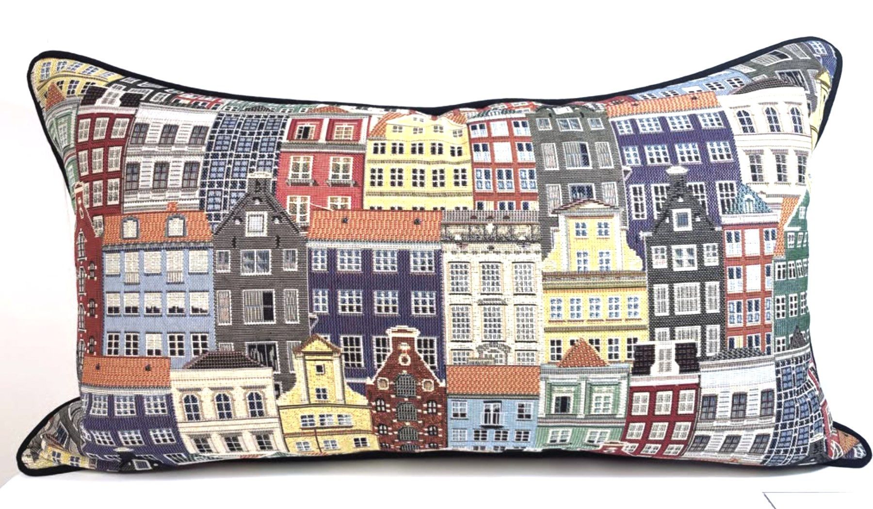 Lumbar pillow in a woven tapestry of European canal-house facades, finished with navy contrast piping